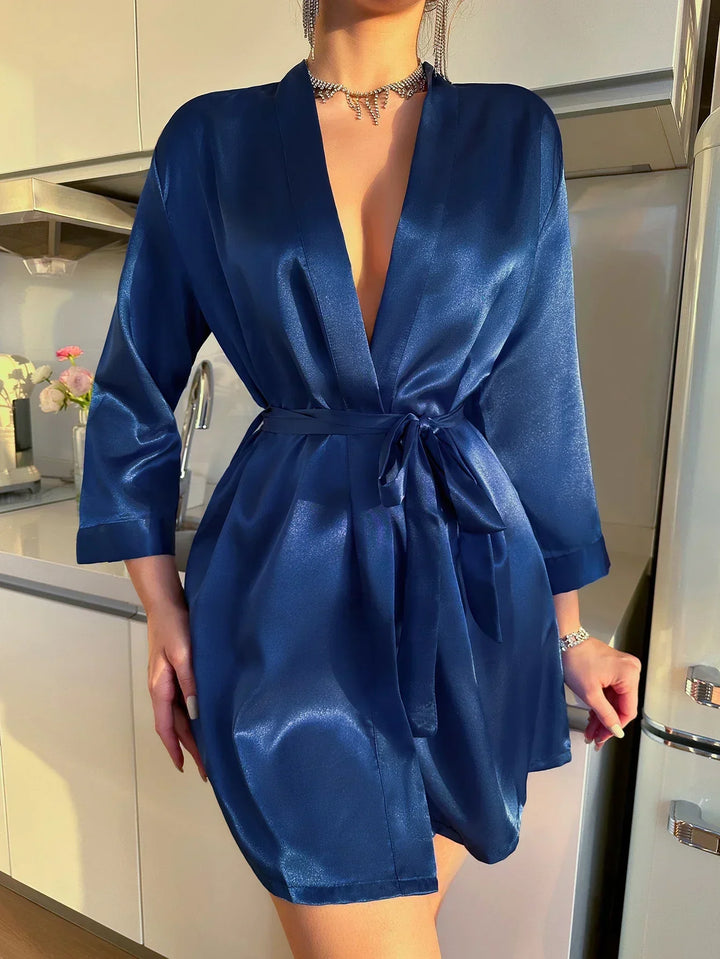 Noémie Glacé Silk morning dress for women. Elegant, relaxed fit with beautiful lace-up detail for luxurious loungewear.