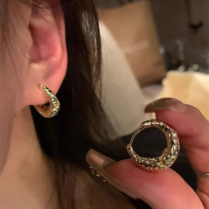 Chic women's silver hoop earrings, a stylish jewelry accessory for an elegant touch.