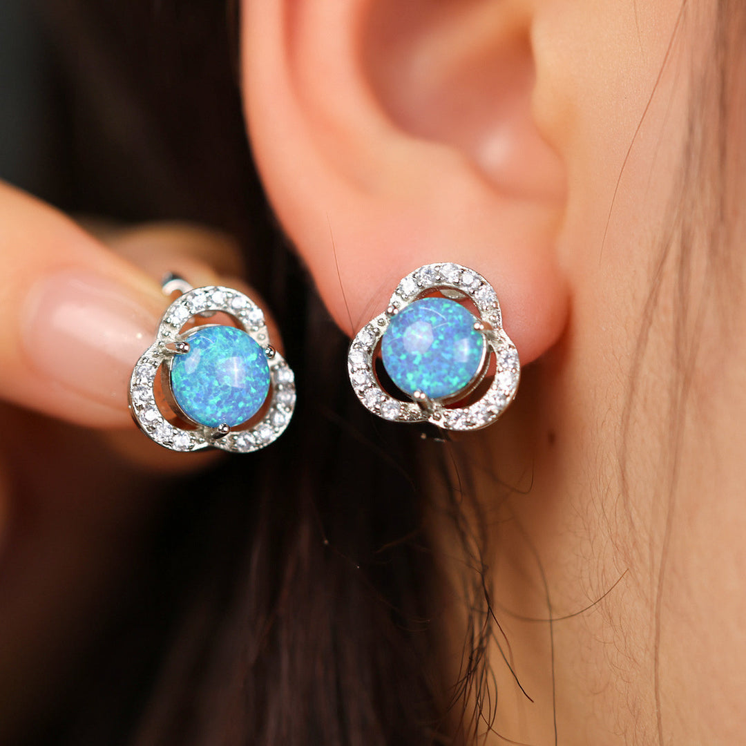 Elegant silver clover leaf stud earrings with shimmering opal & zircon for women.