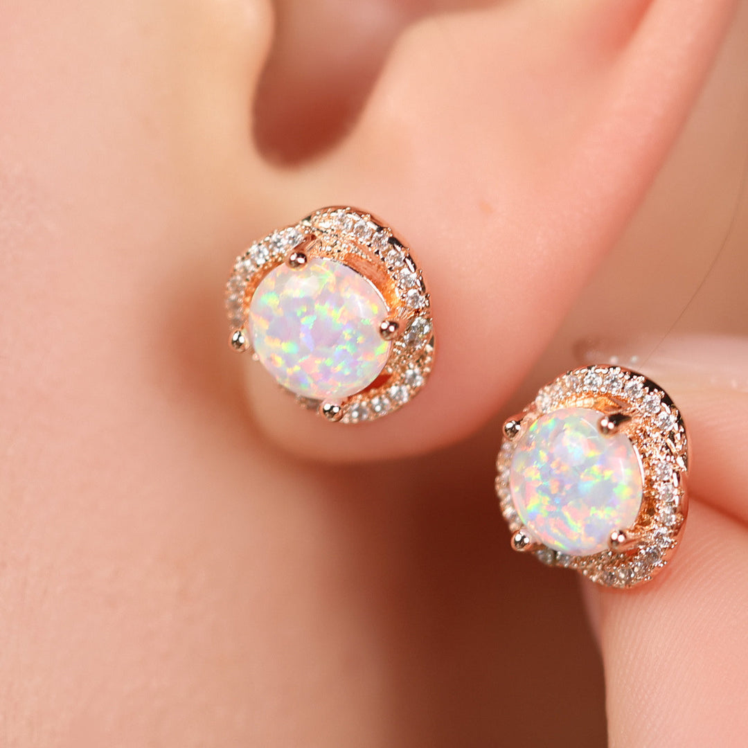Delicate rose gold women's stud earrings, clover leaf design with white opal & zircon.