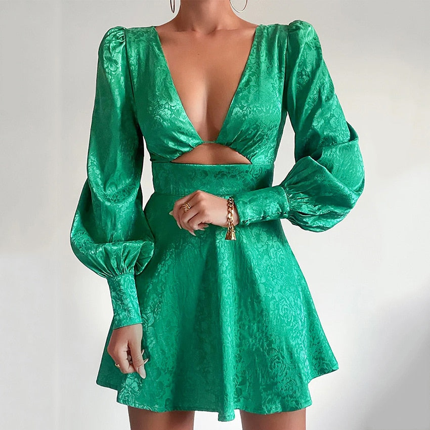 Fashionable women's party dress featuring a vibrant print, puff sleeves, V-neck, and a flattering flared design.
