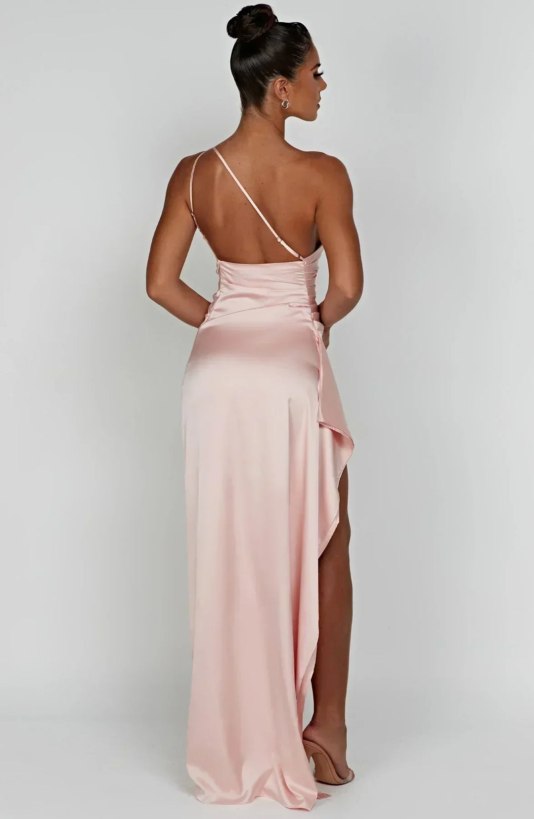 Stylish marine blue satin gown, flowing pleats, and an eye-catching unique shoulder.