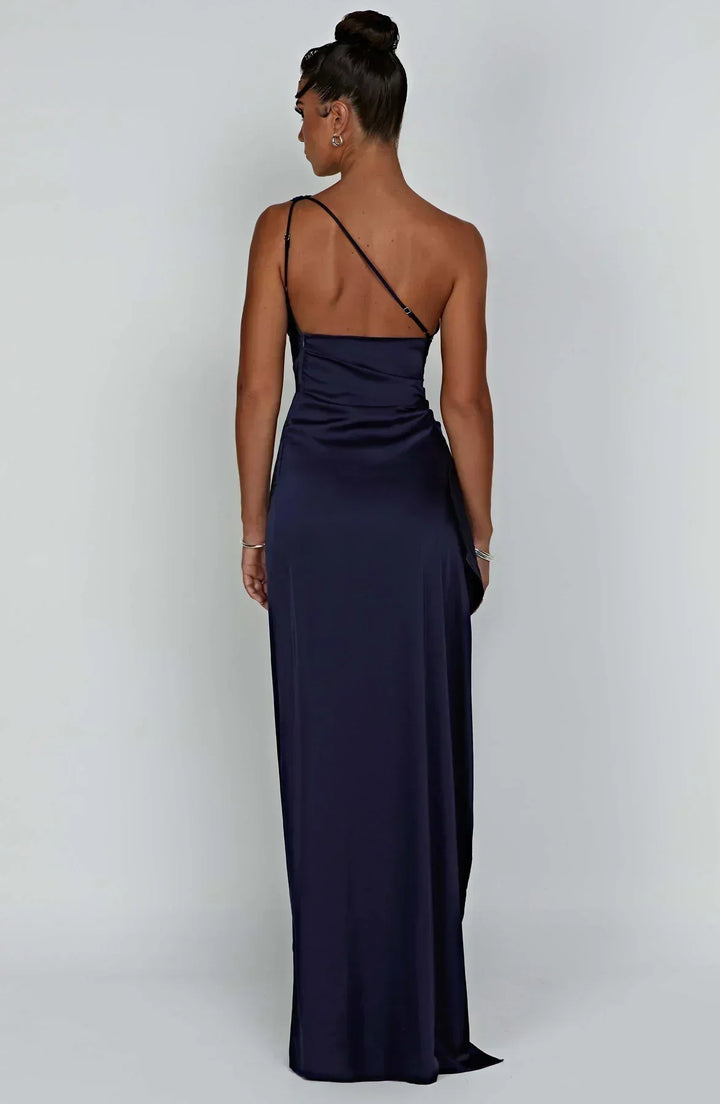 Black satin evening dress, sophisticated pleats, and a graceful unique shoulder feature.