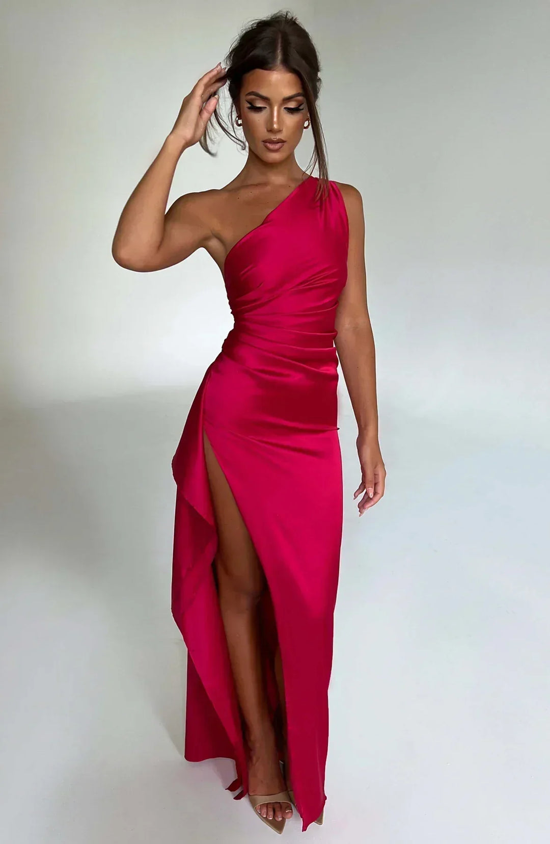 Marine blue elegant evening gown with luxurious pleats and chic one-shoulder detail.