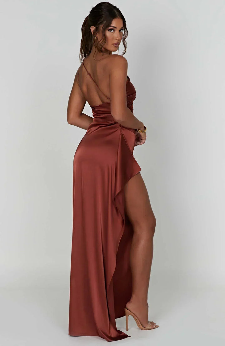 Sophisticated black pleated dress, unique shoulder design, ideal for formal events.