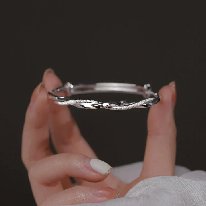 Close-up of an intricate sterling silver bracelet for women, highlighting its elegant detailed craftsmanship.