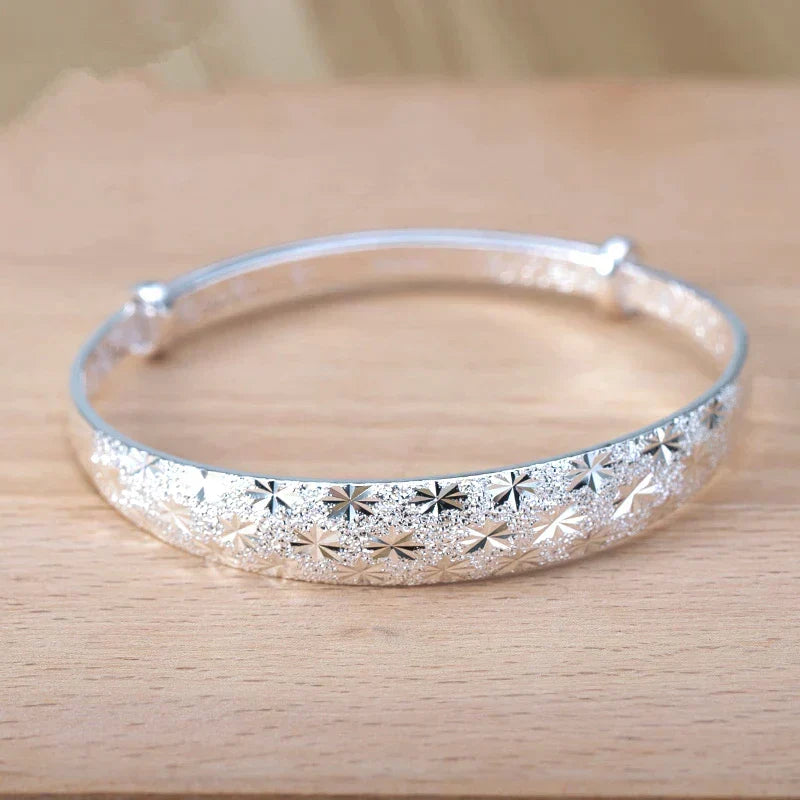 Stunning women's silver star charm bracelet, sterling silver, adjustable for a perfect fit.
