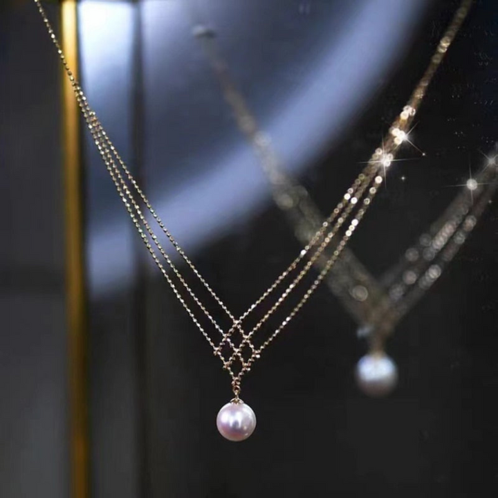 Close-up of a meticulously woven pearl necklace, highlighting the elegant pearls and intricate craftsmanship.