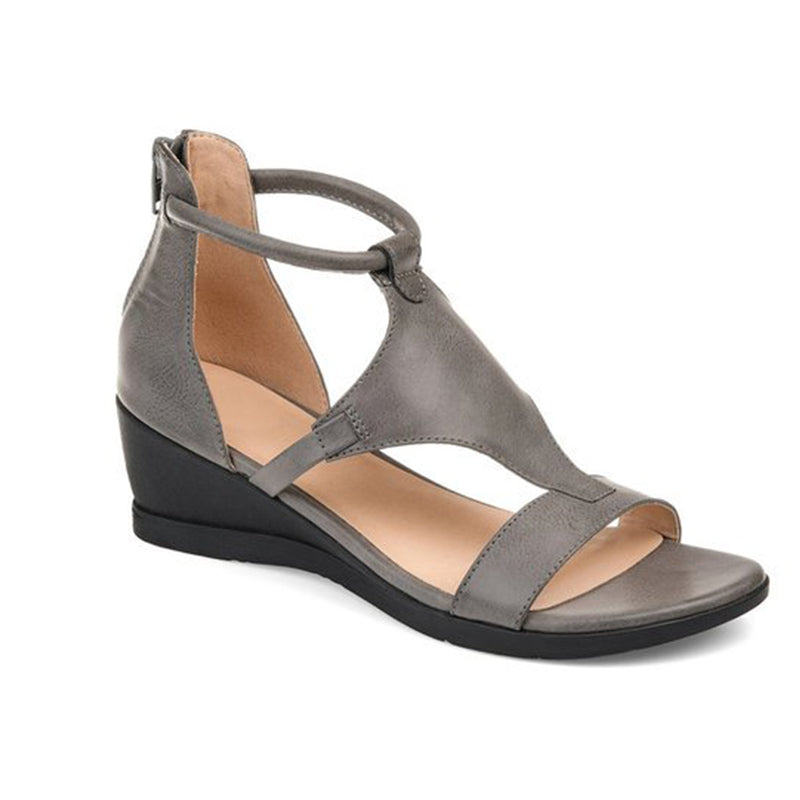 Side view of elegant women's elevated heel sandals with a secure adjustable ankle strap, high fashion footwear.