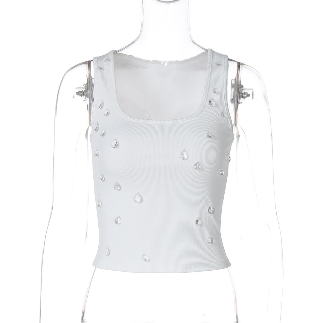 Model wearing a trendy embellished women's crop top, figure-hugging, ideal for a summer festival look.