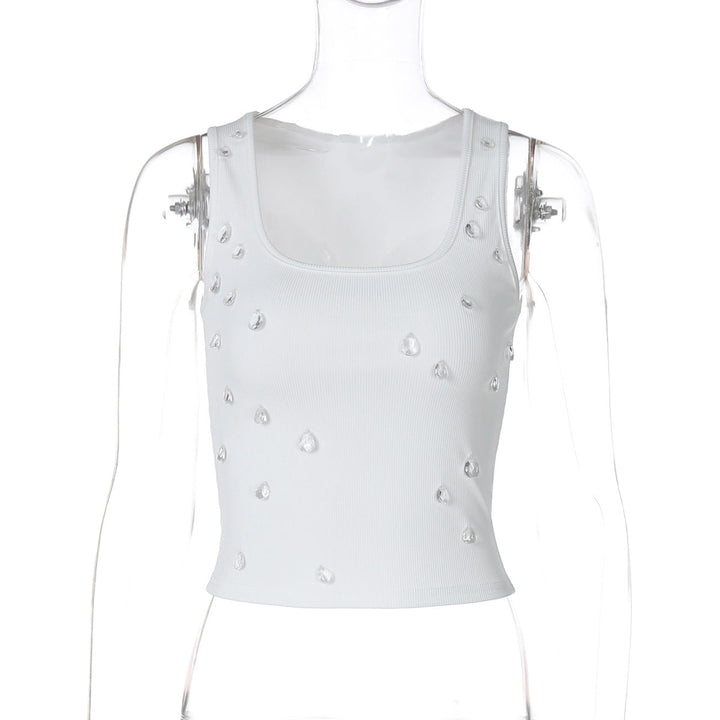 Model wearing a trendy embellished women's crop top, figure-hugging, ideal for a summer festival look.
