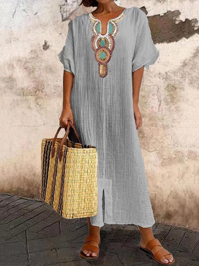 Women's embroidered kaftan maxi dress. Breezy summer style, perfect flowy beach wear, and elegant holiday outfit.