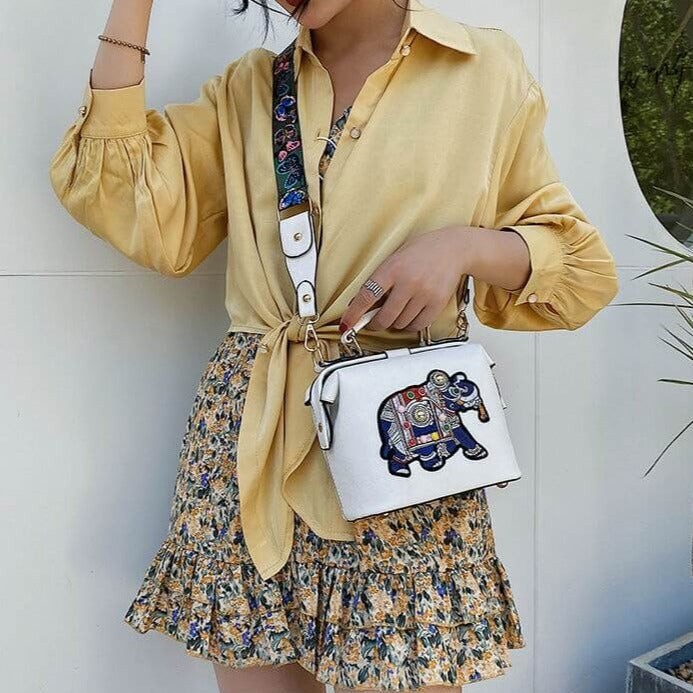 Embroidered mandala shoulder bag displayed open, revealing interior space and multi-use functionality