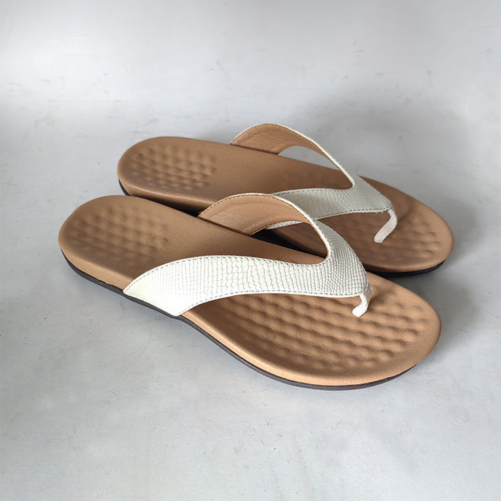 Comfortable women's ergonomic flip flops with arch support, perfect for beach, vacation & stylish summer wear.