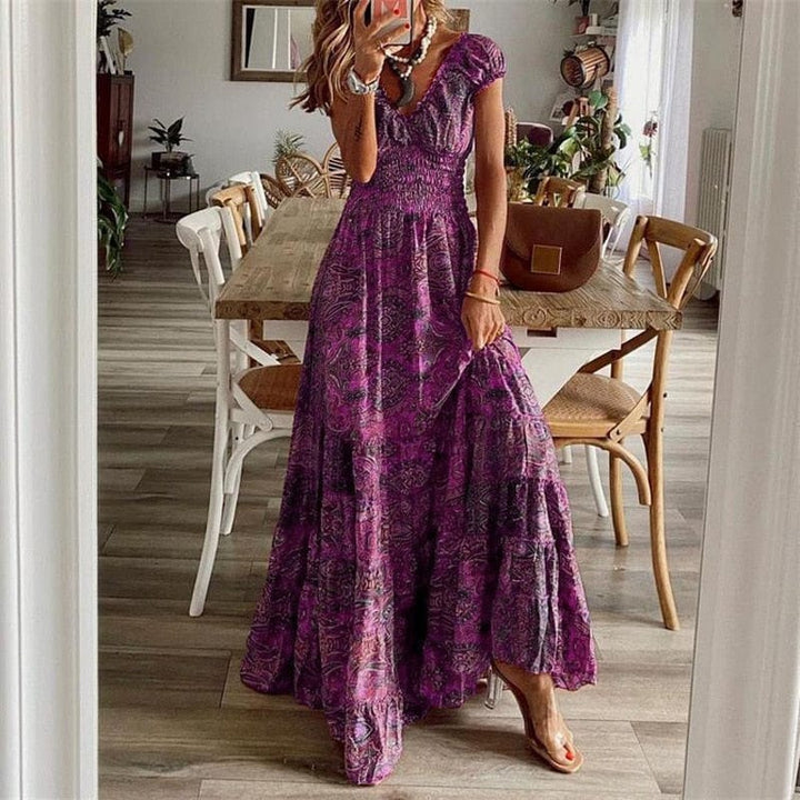 Casual long V-neck maxi dress for women, featuring a unique ethnic print. Effortless summer fashion.