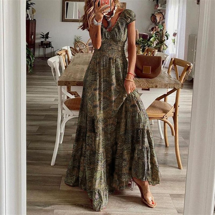 Elegant V-neck women's maxi dress with a distinctive ethnic print, offering a chic & flowy summer look.