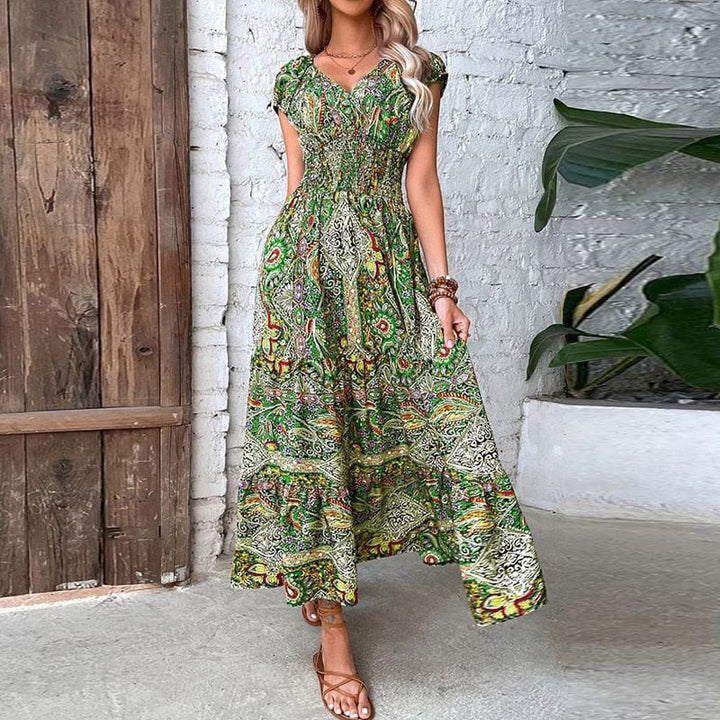 Model wearing a full-length women's ethnic print V-neck maxi dress, showcasing flowy summer style.