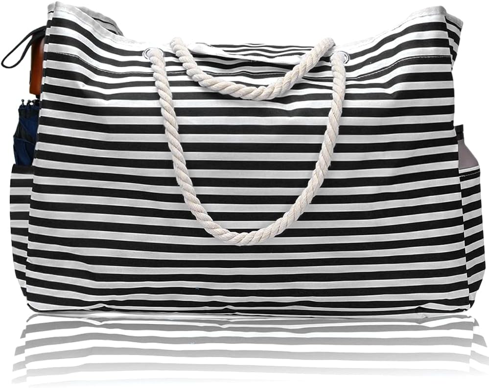 Close-up of the waterproof fabric and sturdy handles of the extra large women's beach tote with bonus pouch.