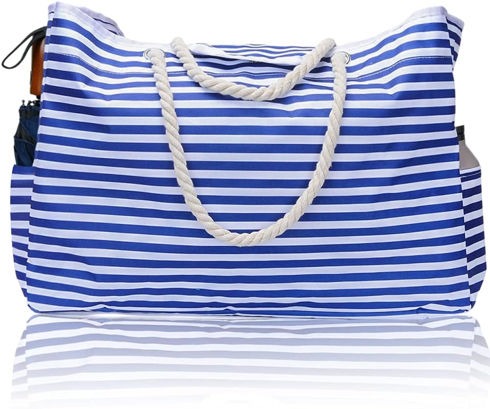 CoastCarry women's waterproof beach tote with bonus pouch. Ideal extra large bag for beach, pool, or travel.