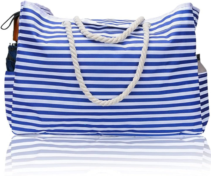 CoastCarry women's waterproof beach tote with bonus pouch. Ideal extra large bag for beach, pool, or travel.