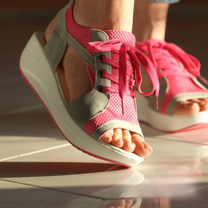 Comfortable Fergie beach sandals for women, designed for easy wear and summer activities.