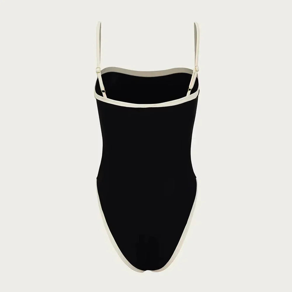 Chic women's color block one-piece swimsuit, perfect for a stylish and comfortable summer beach or pool day.
