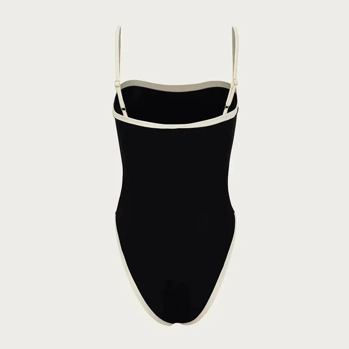 Chic women's color block one-piece swimsuit, perfect for a stylish and comfortable summer beach or pool day.