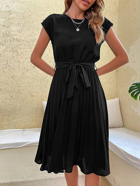 Flattering pleated short sleeve women's summer dress. Elegant midi cut, comfortable for sunny days.