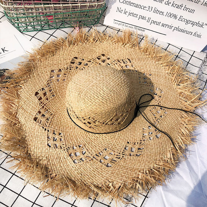 Women's floppy Panama hat with decorative band, perfect for summer beach fashion