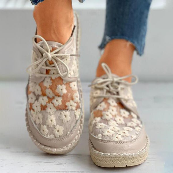 Casual summer women's shoes with vibrant floral embroidery, providing arch support for travel.