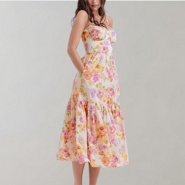 Full-length view of a woman wearing a casual floral flared midi dress in summer