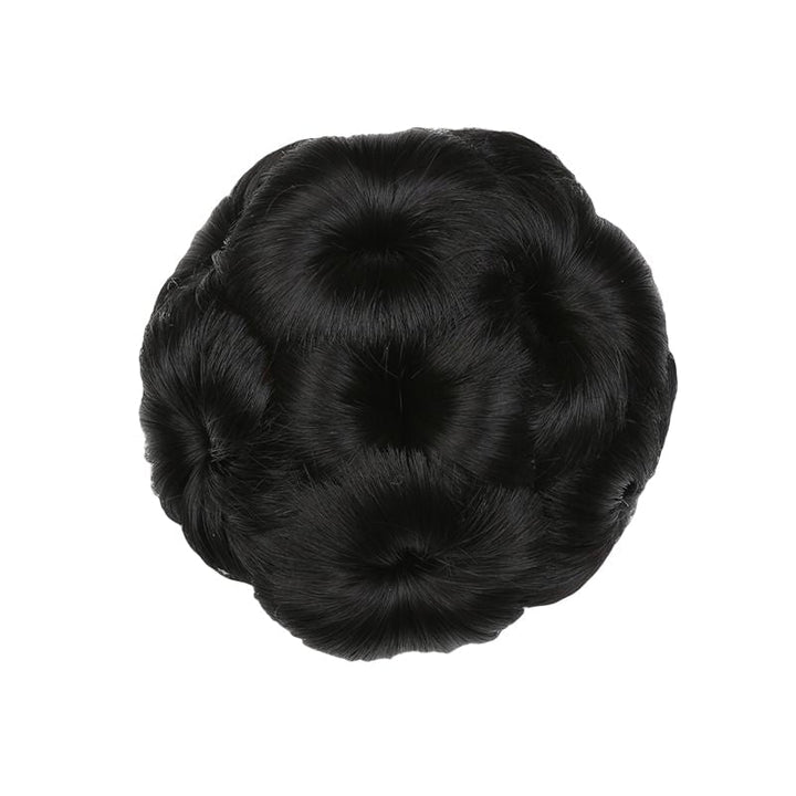 Wedding guest hair: Floral hair clip with synthetic extension for a polished updo.