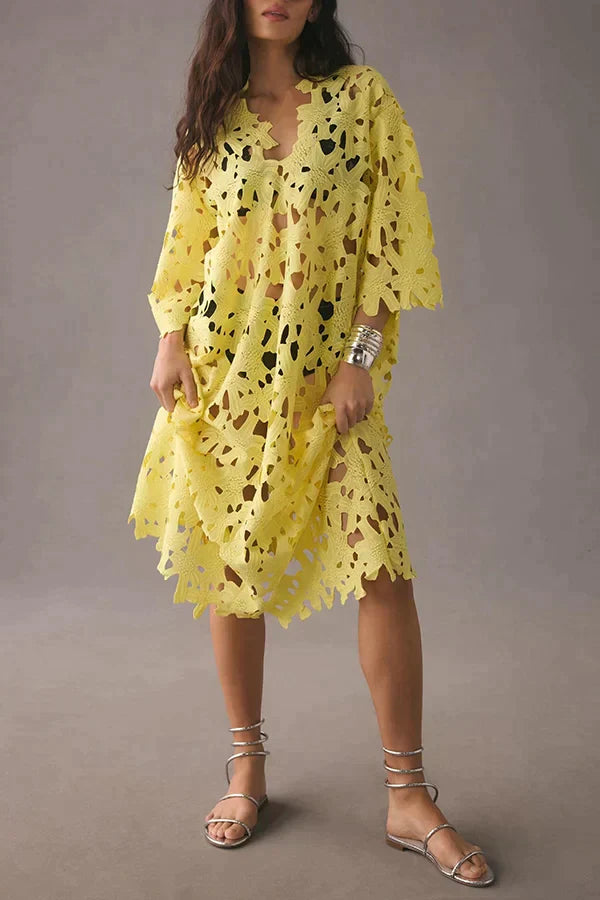 Women's floral midi dress with eyelet lacing, flowing fabric for summer casual wear