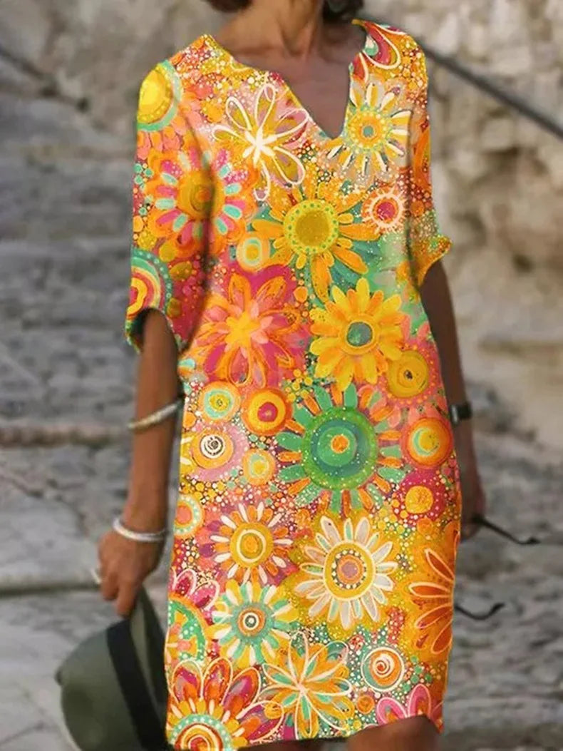 Women's floral print midi summer dress with half sleeves, ideal for casual elegance & comfortable vacation wear.