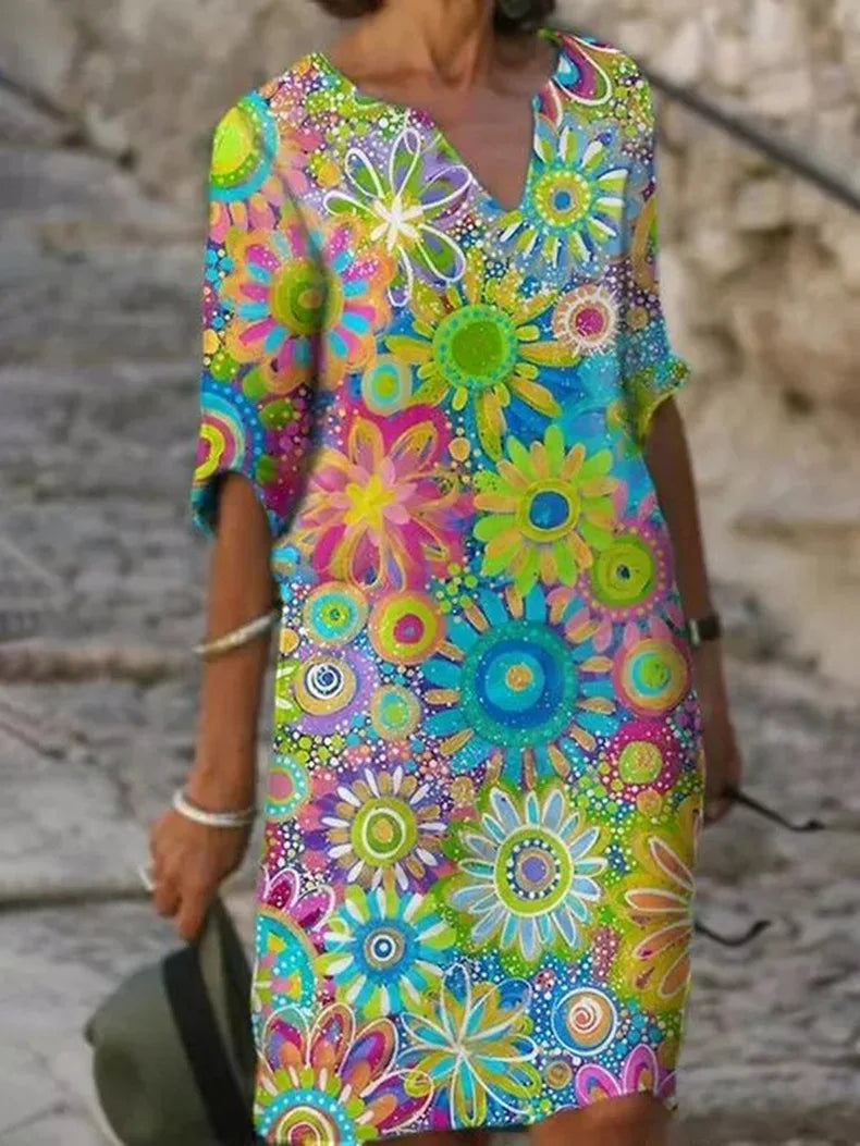 Comfortable women's floral print summer midi dress with half sleeves, great for vacation outfits.