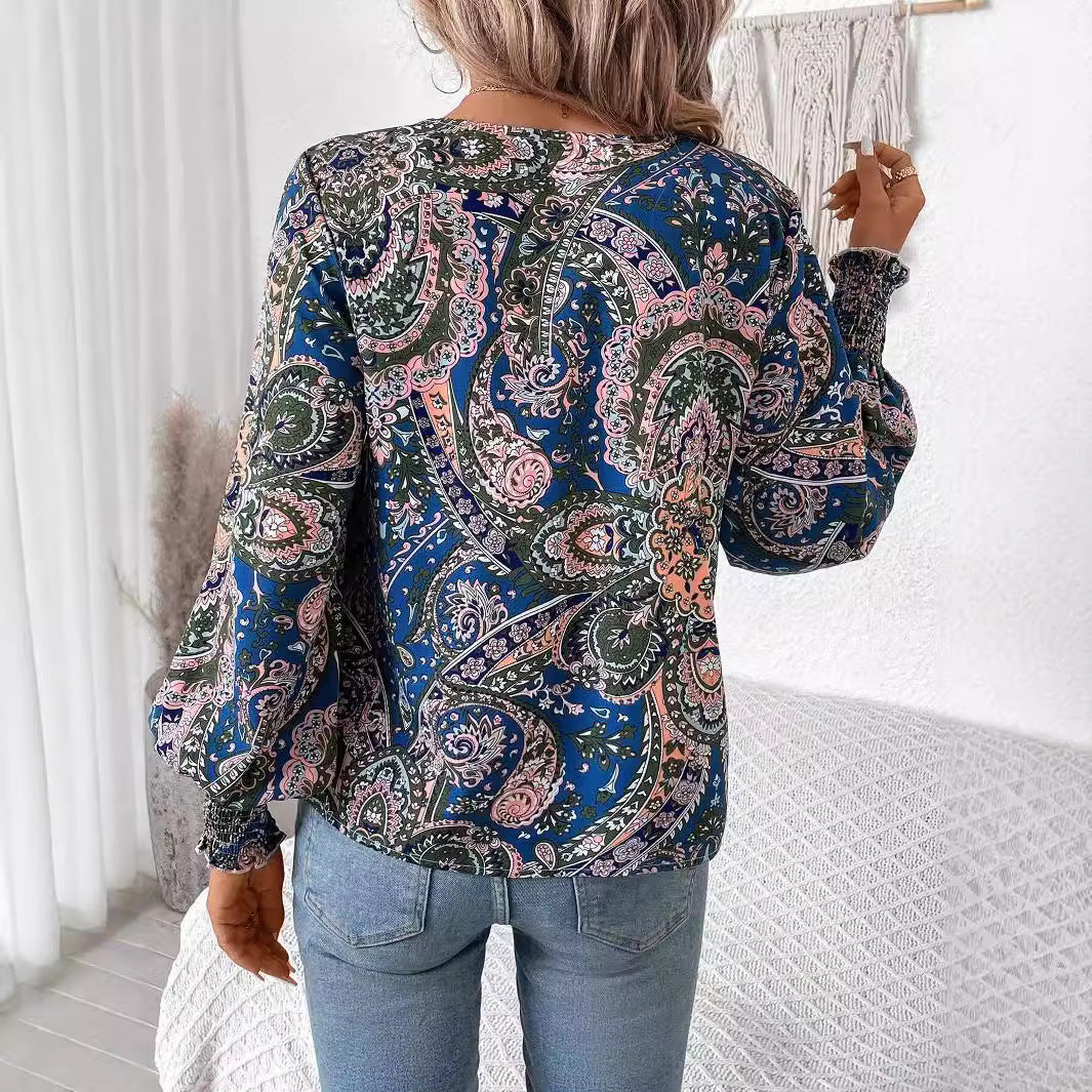 Casual yet elegant floral print V-neck blouse for women. Features stylish lantern sleeves & loose fit.