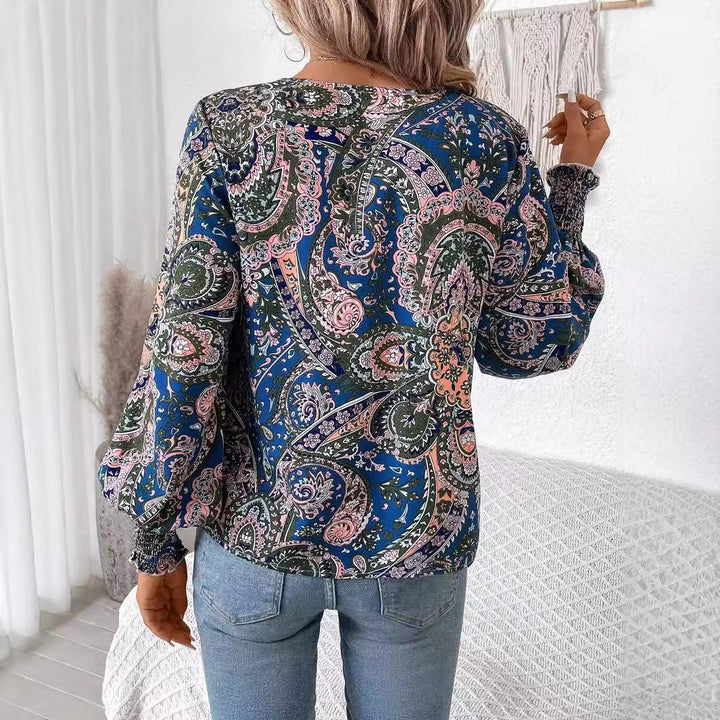 Casual yet elegant floral print V-neck blouse for women. Features stylish lantern sleeves & loose fit.