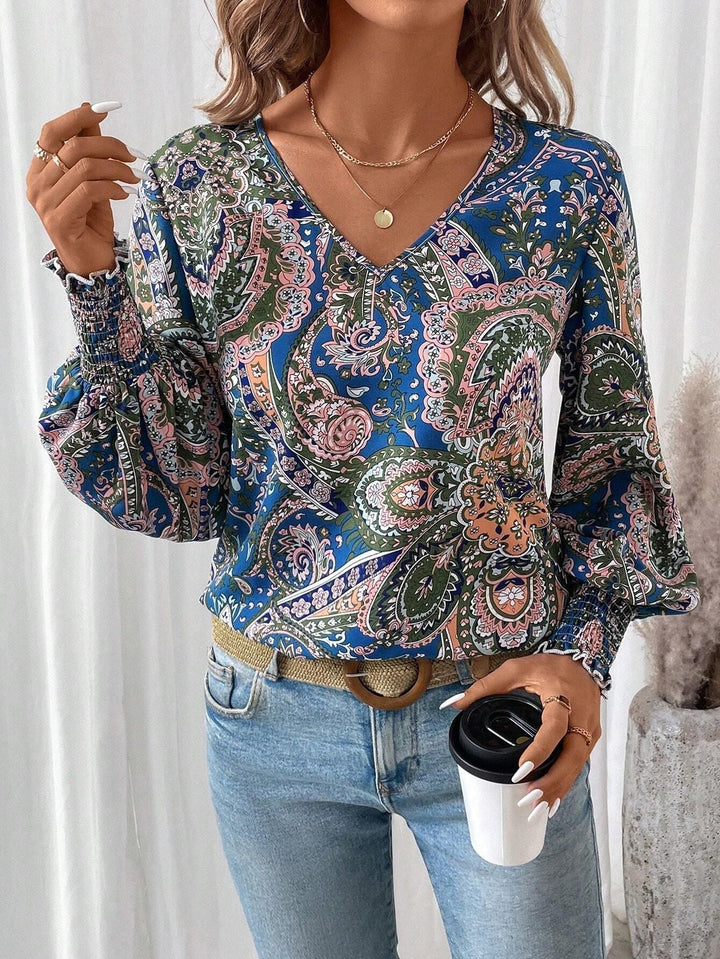 Stylish women's floral print V-neck blouse with lantern long sleeves. Ideal for spring/summer casual & elegant wear.