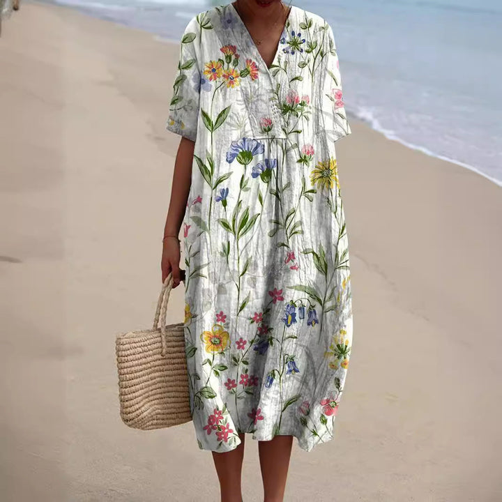 Elegant women's floral print V-neck day dress. Comfortable & flowy summer style, ideal for garden parties.