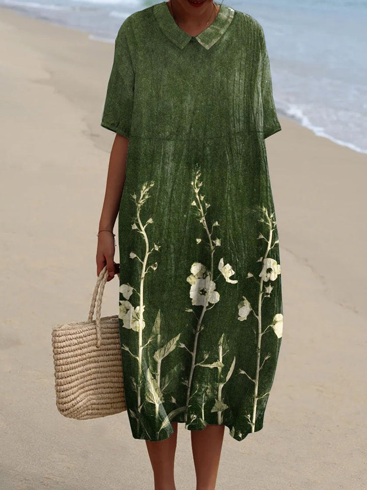 Light & comfortable women's V-neck summer dress featuring a beautiful floral pattern. Perfect for sunny days.