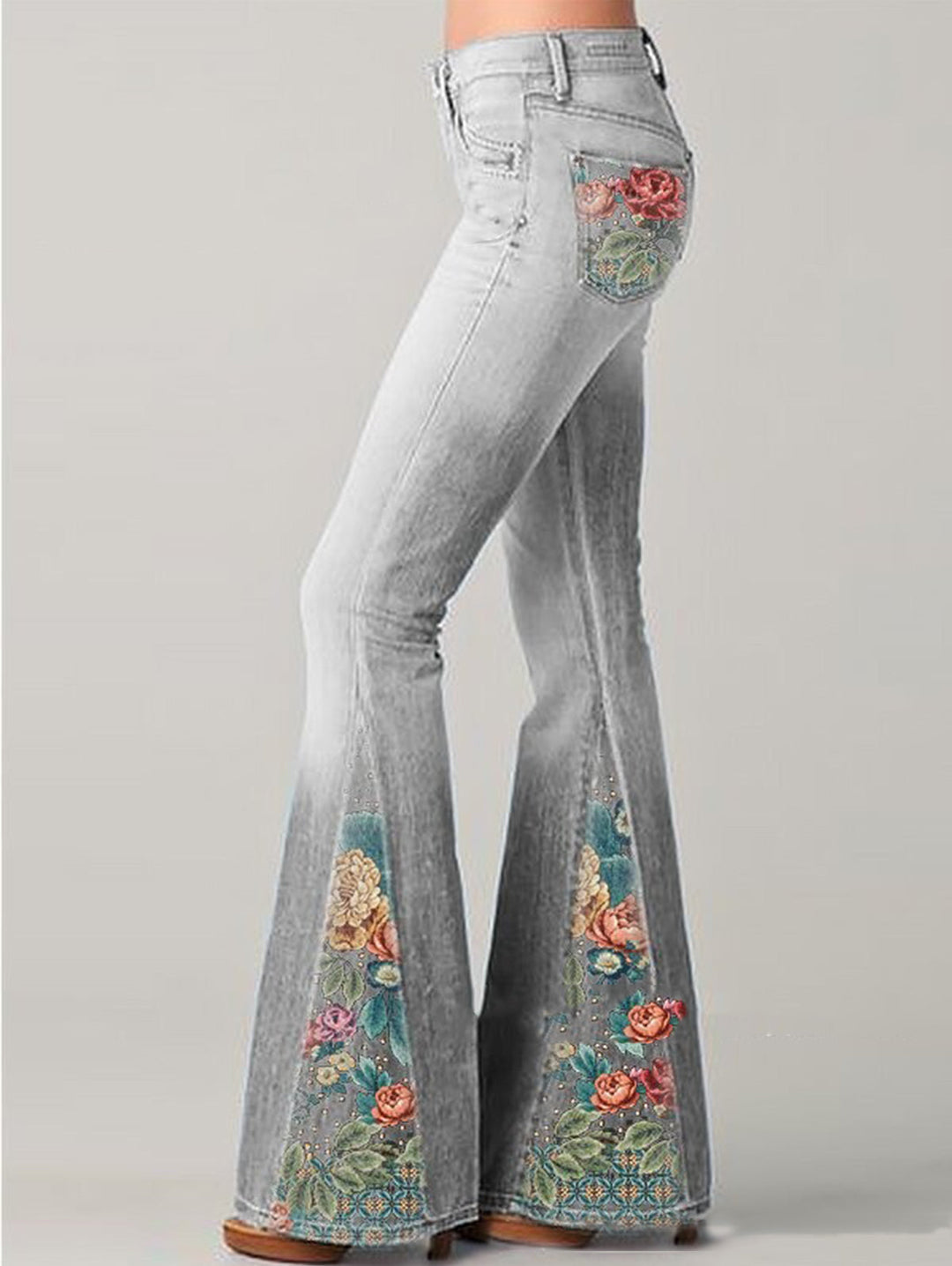Trendy women's flared pants featuring a vibrant floral print and elegant wide leg. Boho summer style.