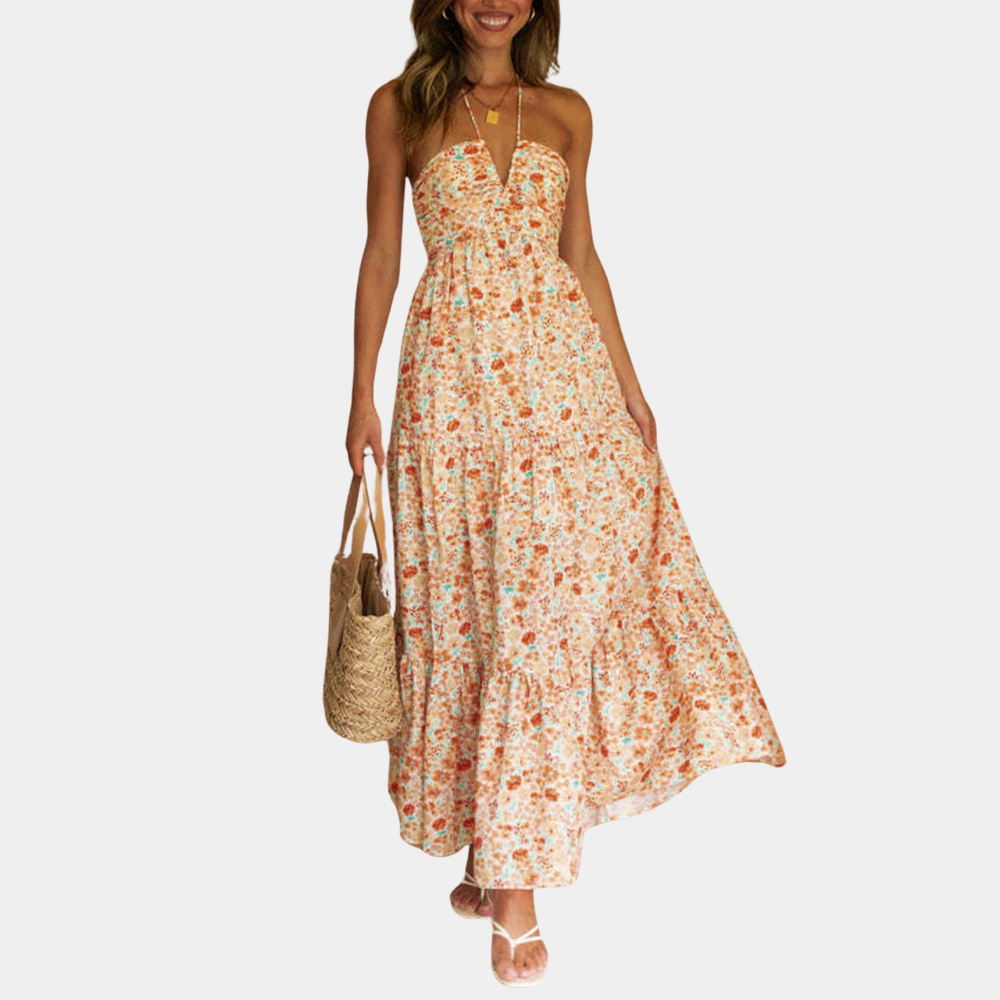 Women's flowy boho halter neck maxi dress in a vibrant summer color, perfect for vacation.