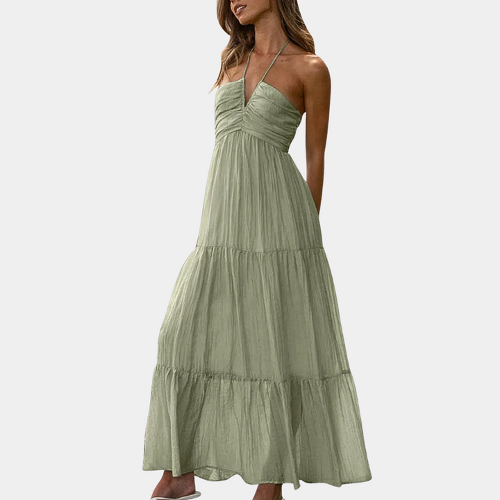 Halter neck flowy maxi dress for women, suitable for summer casual wear and beach vacations.
