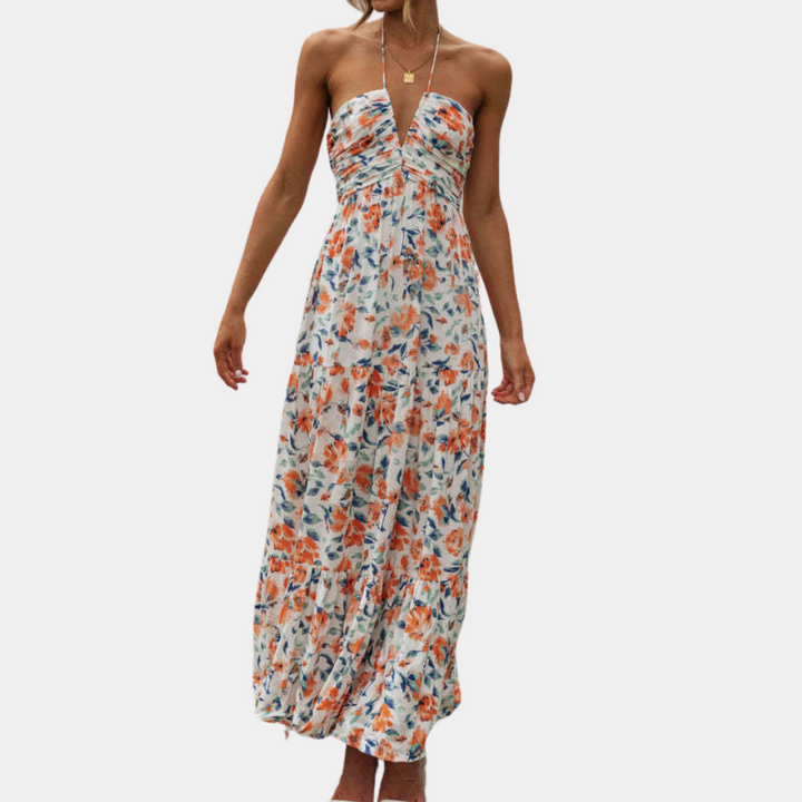 Women's long summer dress with a comfortable halter neck and a beautiful flowing fabric.