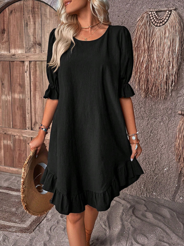 Women's holiday boho summer dress with short sleeves, lightweight & flowy, great for travel & relaxation.