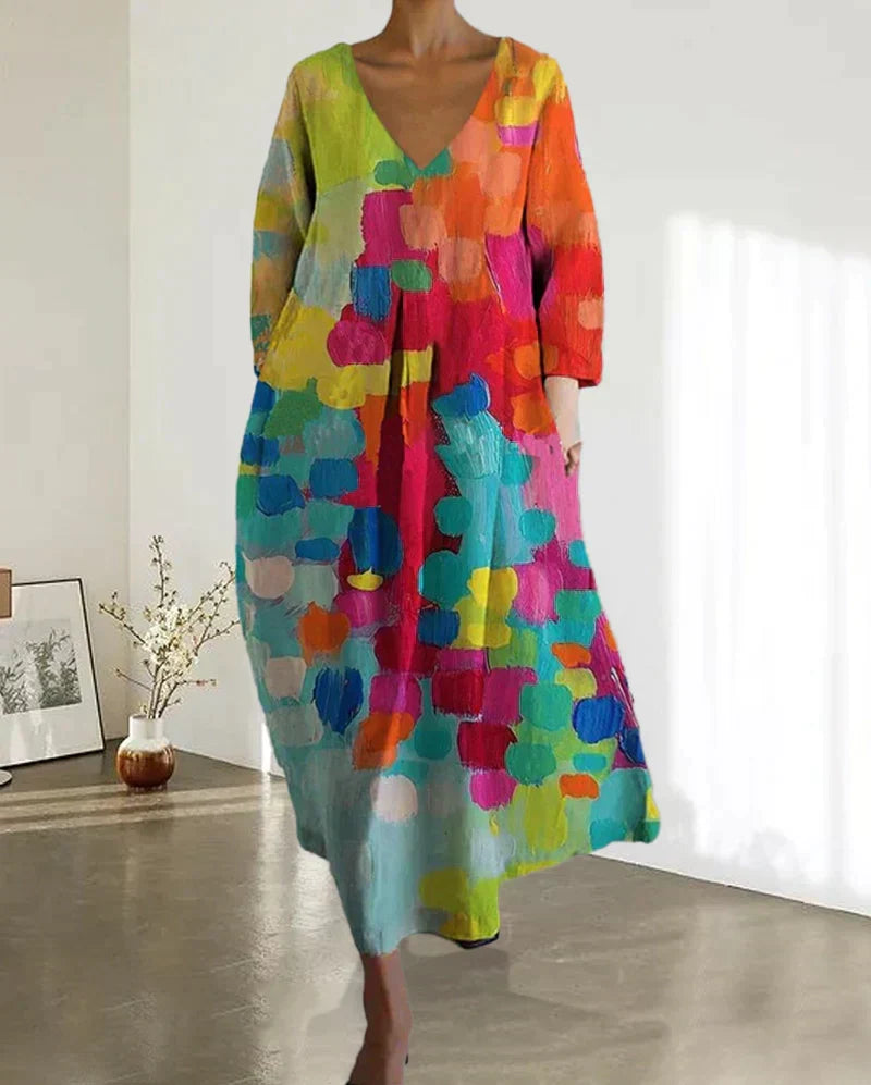 Women's flowy colorful V-neck midi dress with vibrant print. Ideal for summer casual or stylish occasion wear.