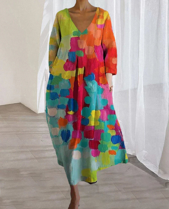 Comfortable women's flowy summer dress, featuring a colorful printed V-neck design. A versatile casual midi dress.