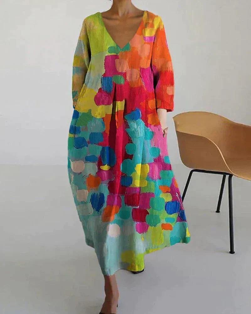 Vibrant women's V-neck midi dress, boasting a colorful flowy print. Great for a casual day or a special occasion.