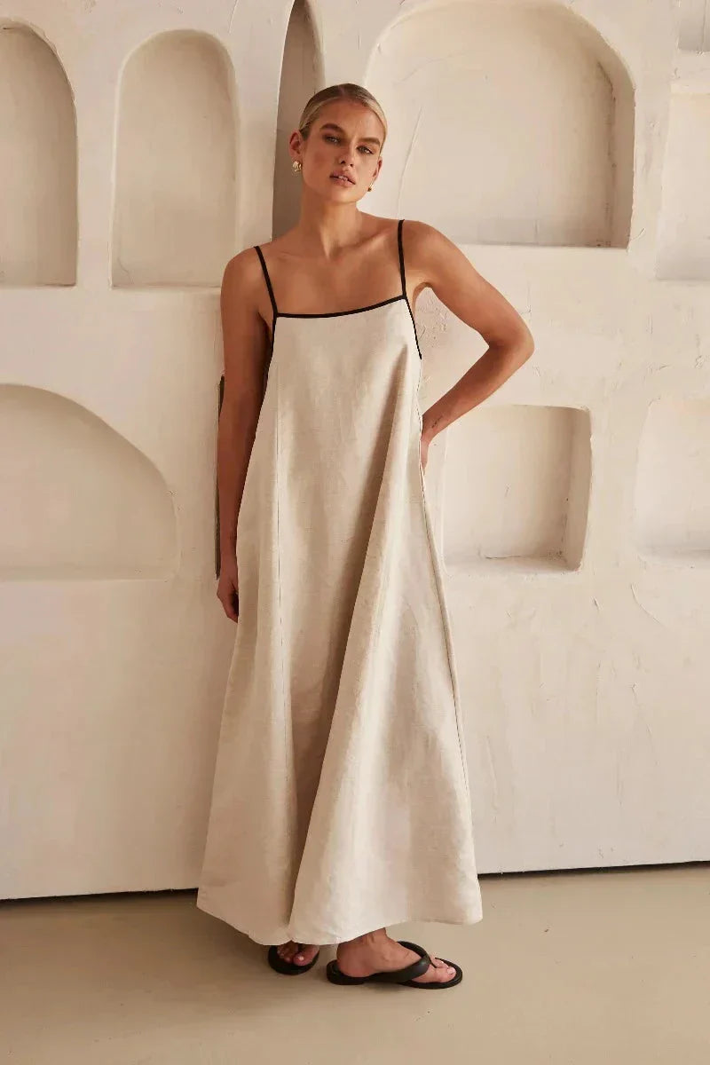 Casual women's long sleeveless beige boho maxi dress, offering a comfortable and flowy fit for summer.