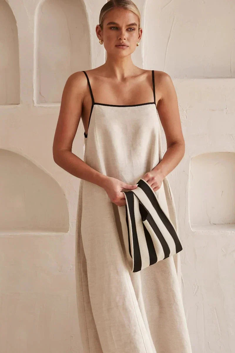 Stylish women's sleeveless beige boho maxi dress with a beautiful flowy silhouette for warm weather.